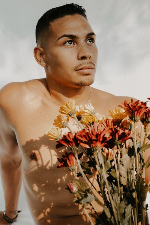 Shirtless Man and a Bouquet of Flowers 
