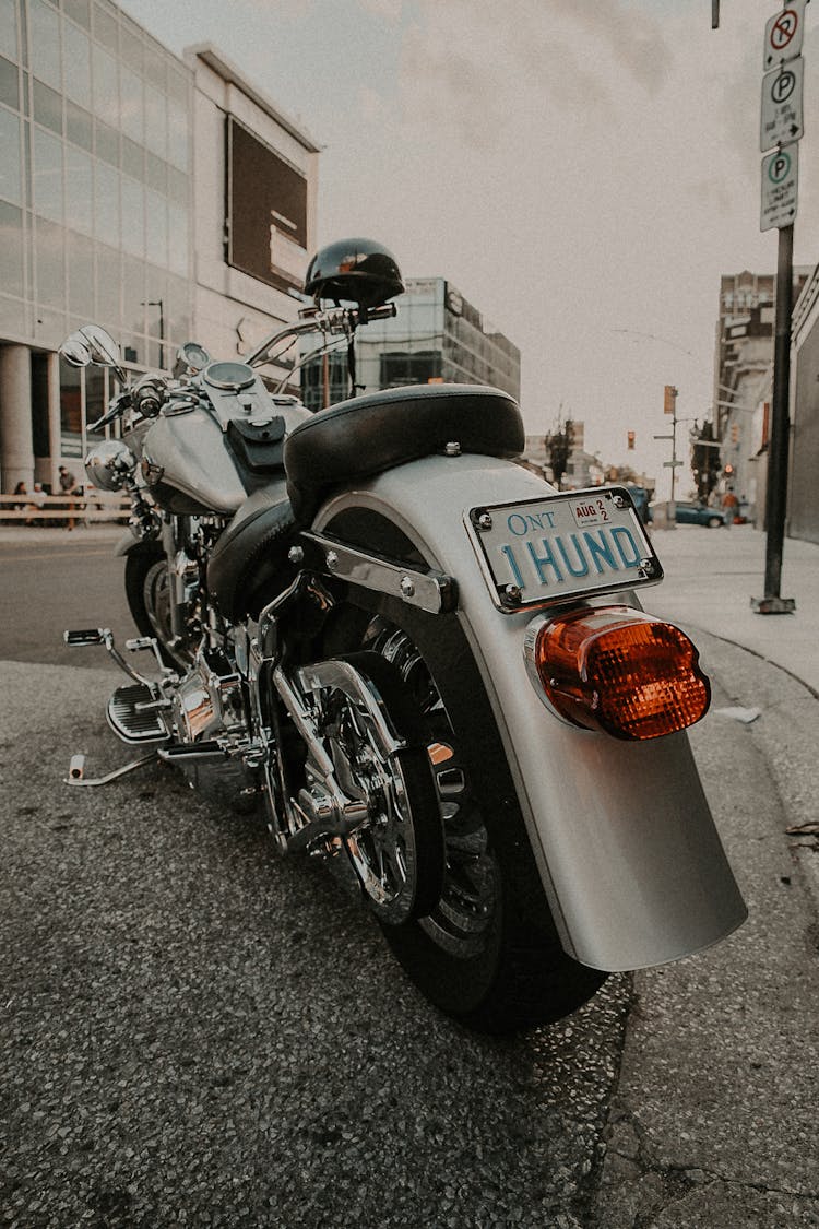 A Motorcycle Parked On A Road 