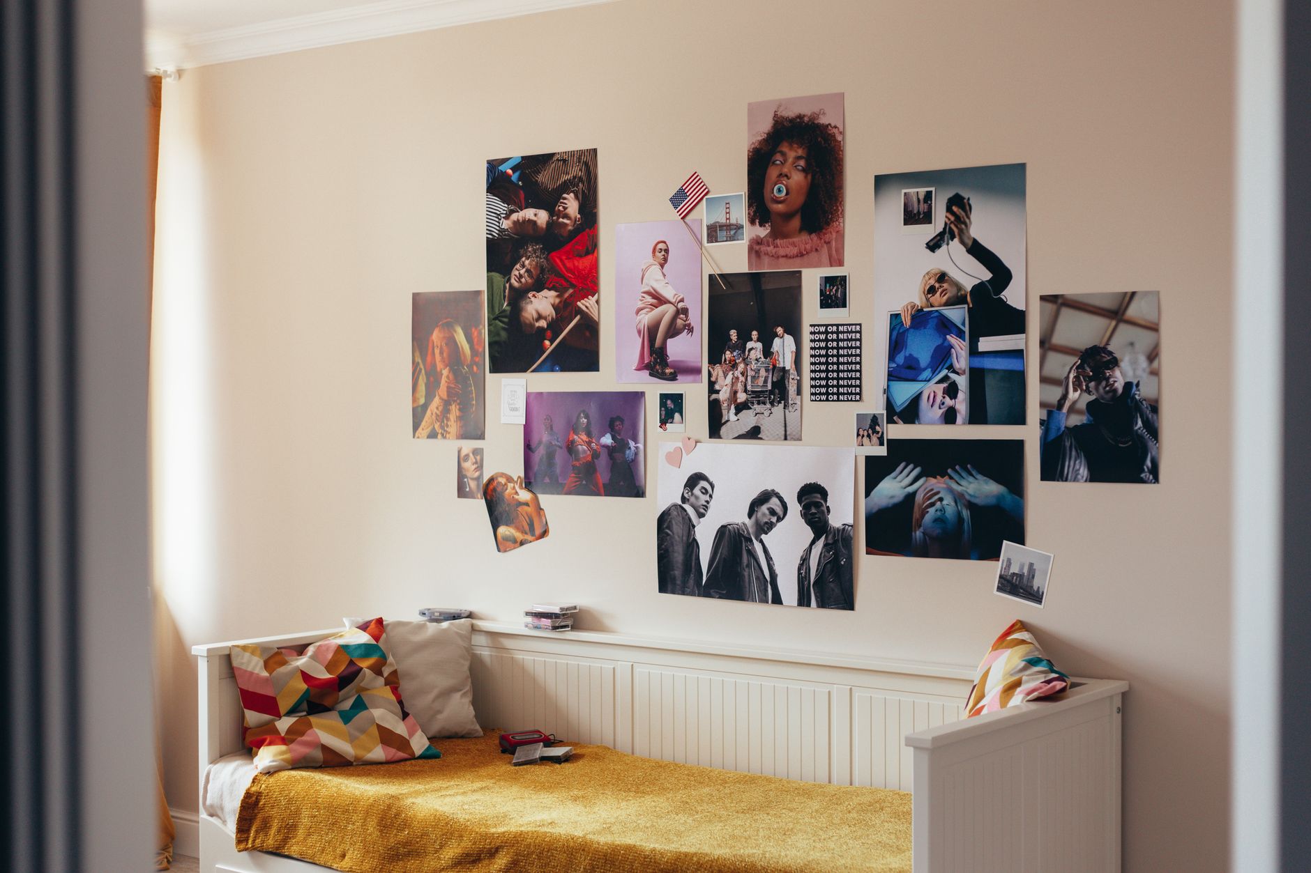 different types of home decor styles Cozy bedroom featuring a vibrant wall of artistic posters and modern design.