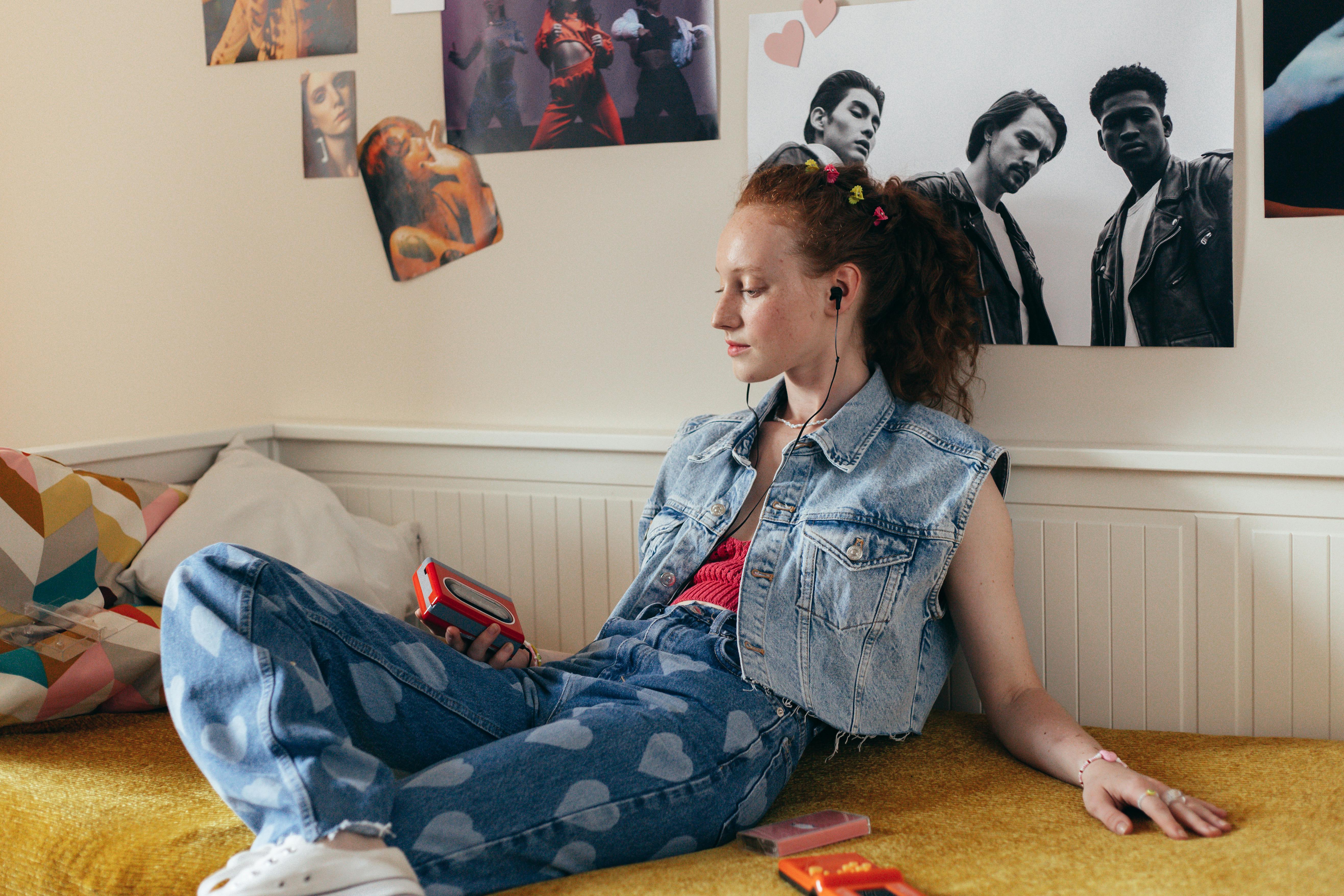 girl listening to a cassette player