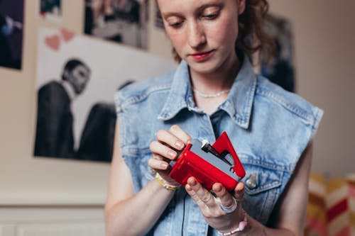 Young Woman Holding a Cassette Player with Tape