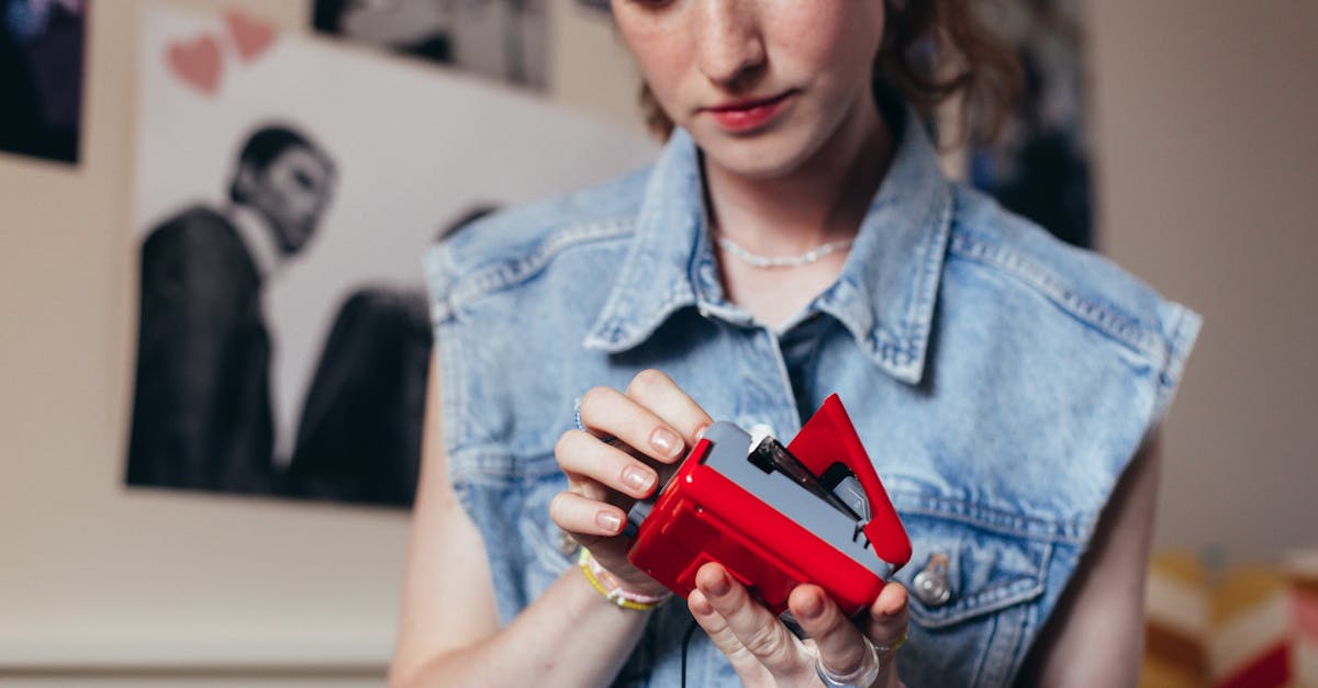 A young woman engages with a vintage cassette player in a cozy room.