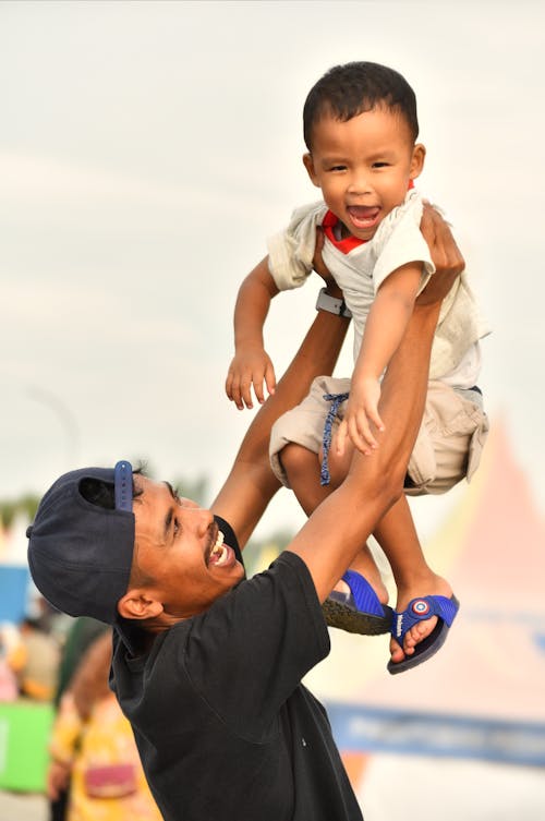 Free Happy Man Lifting Son Stock Photo