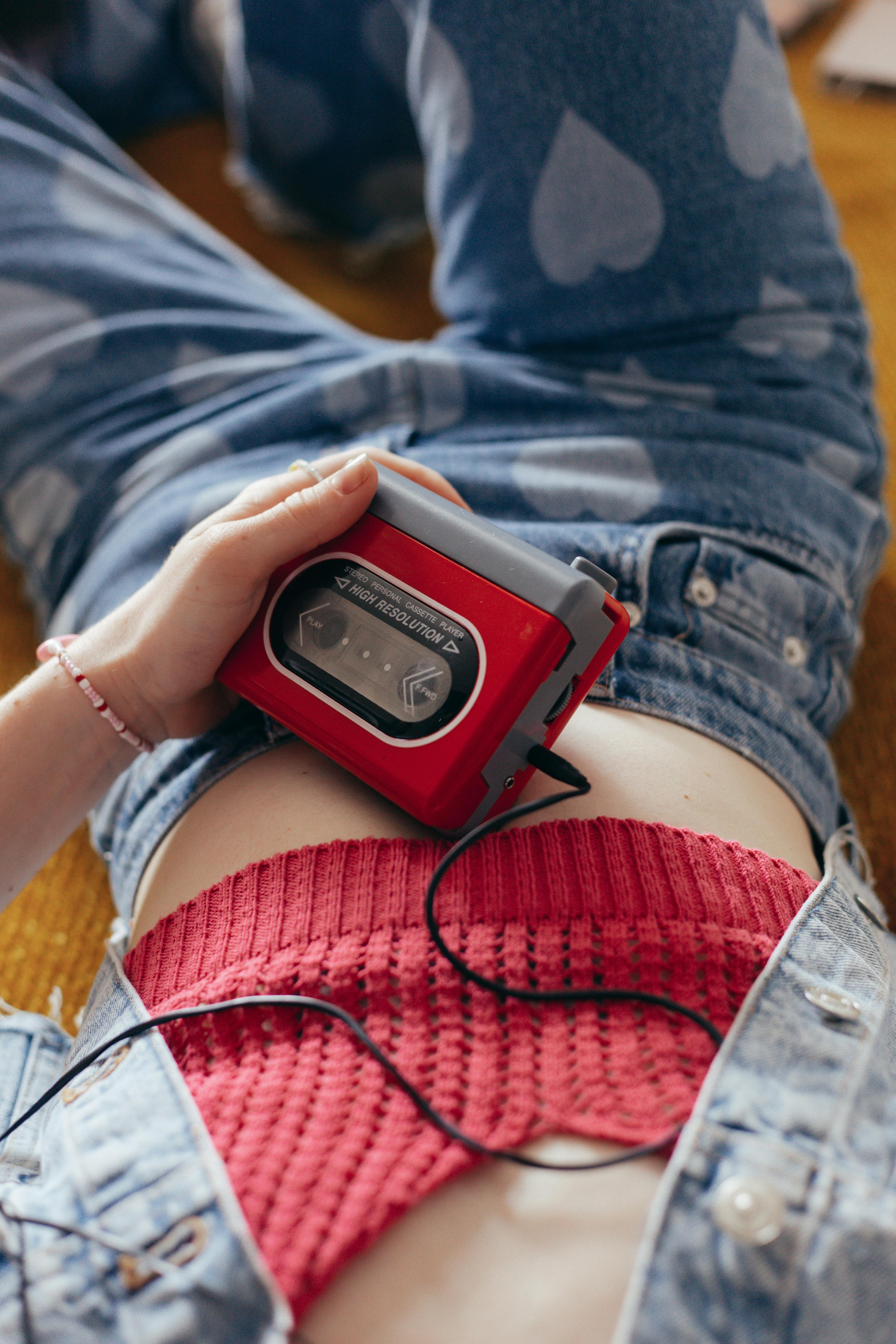 close up shot of a person holding a walkman