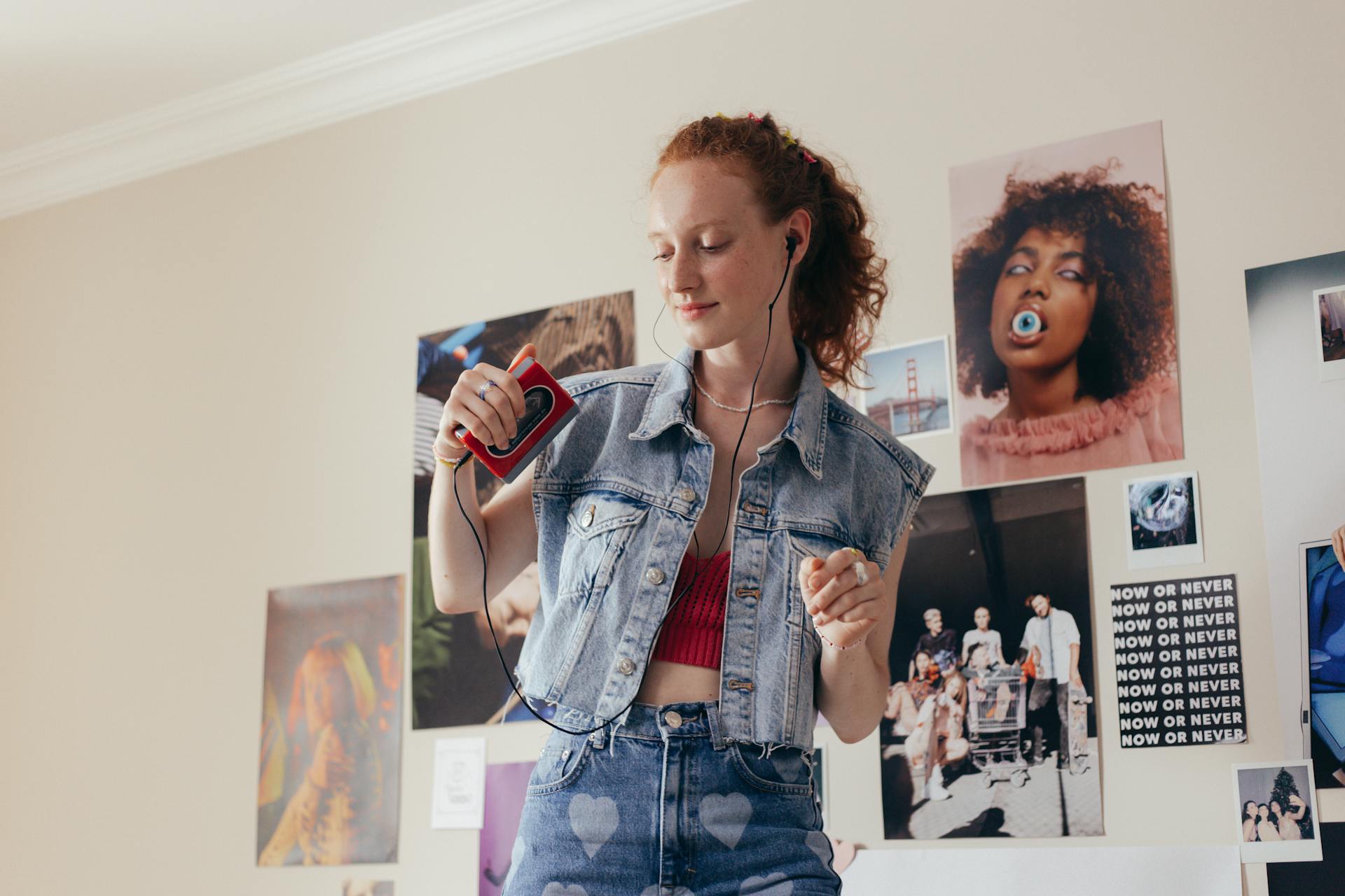 Woman in Denim Vest Dancing to the Music