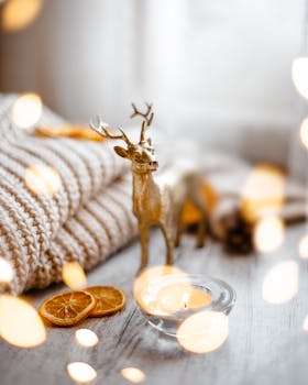 Gold deer figurine with candle, knit fabric, and dried orange slices create a warm Christmas vibe.
