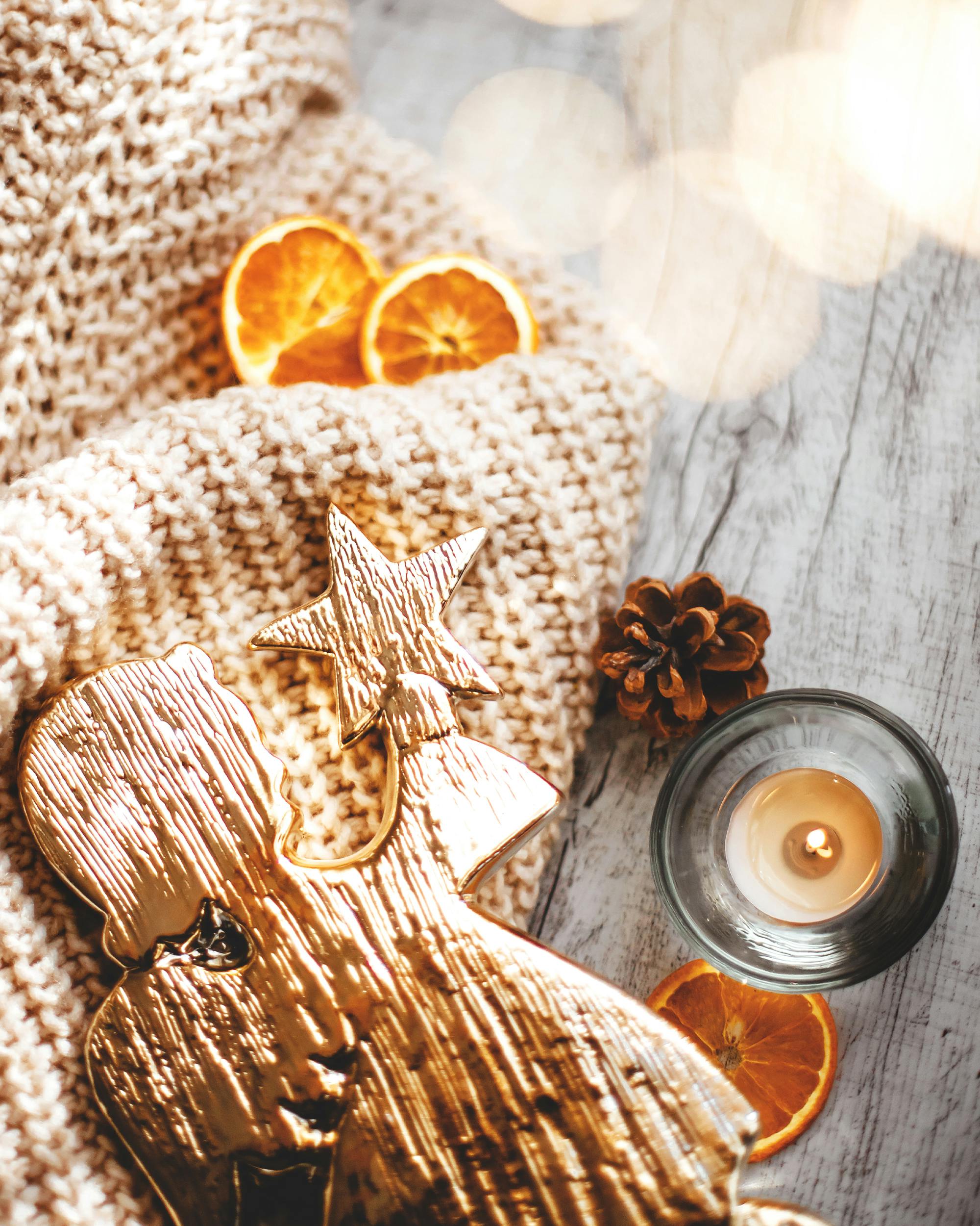 doll with star wax candle cone and orange slices for christmas