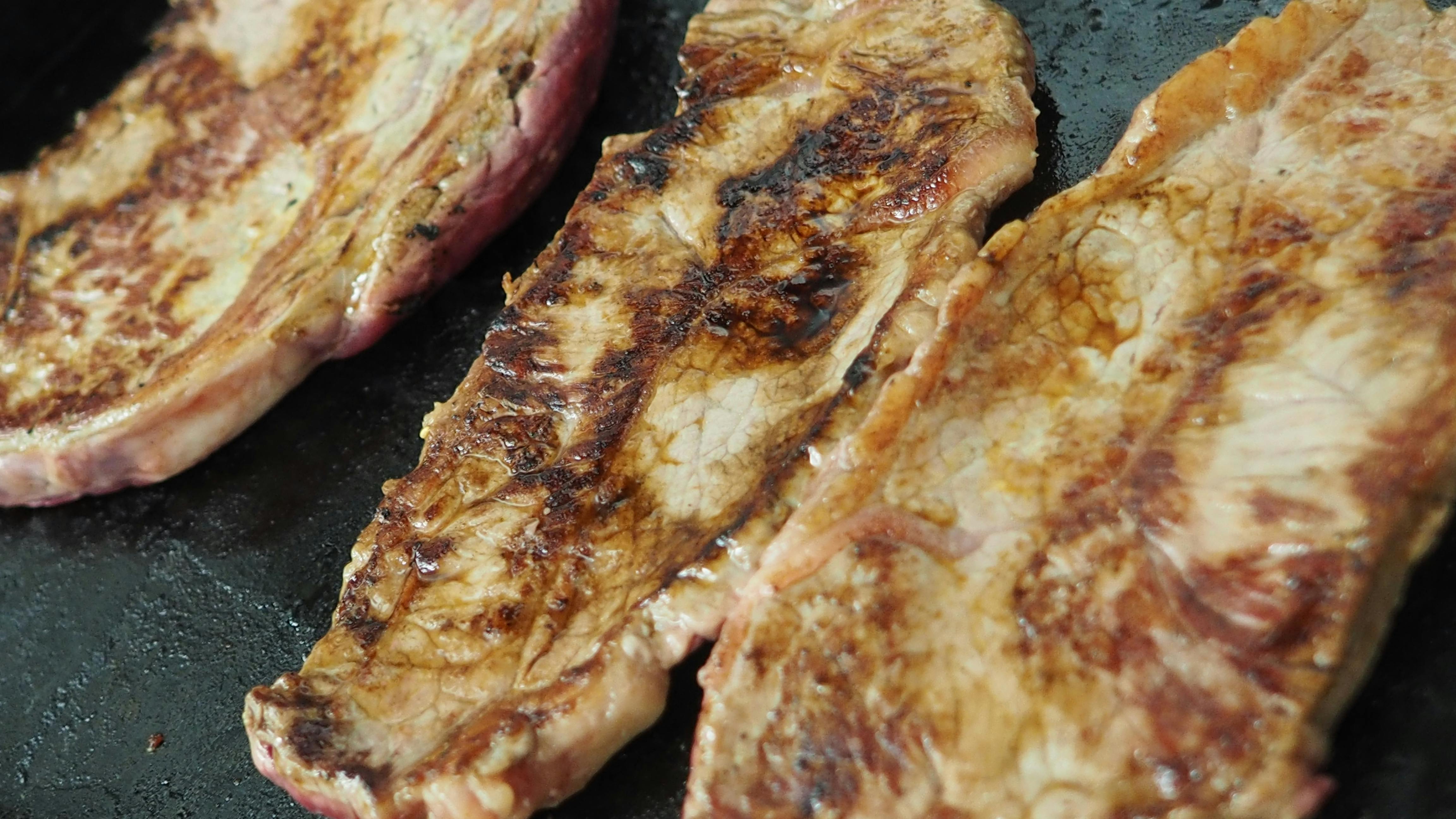 Free stock photo of cooking steak, steak, steak being cooked