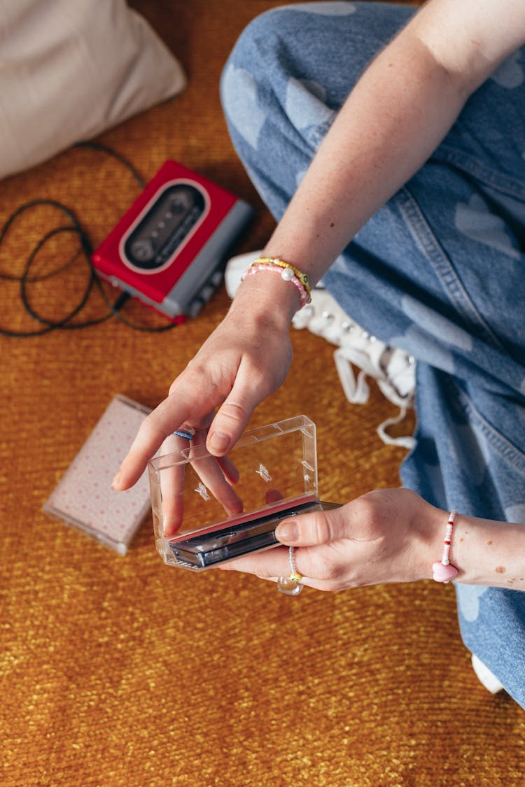 Person Holding Brown And Black Smartphone