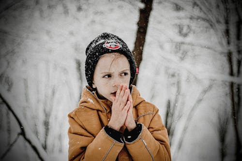 Free Boy Wearing Brown Jacket and Black Beanie Stock Photo