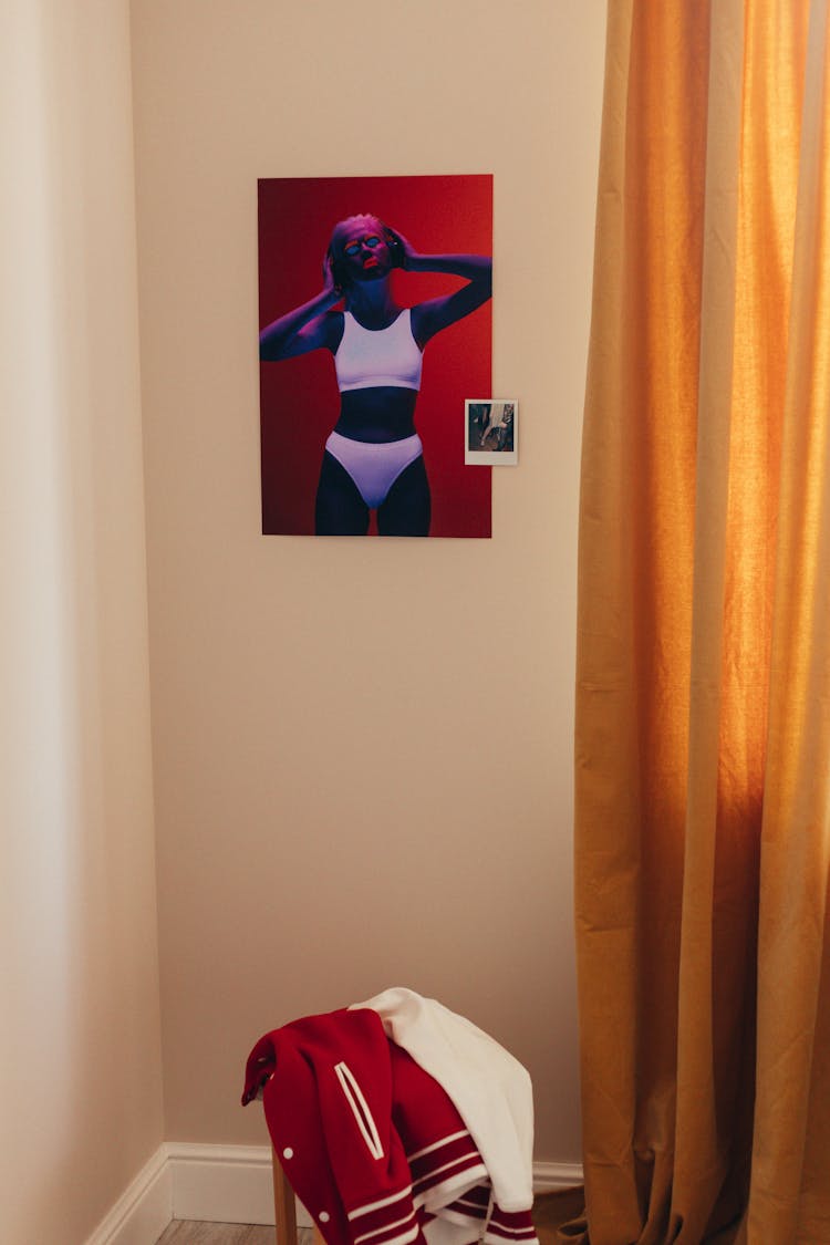 Polaroid Picture And Poster On Wall