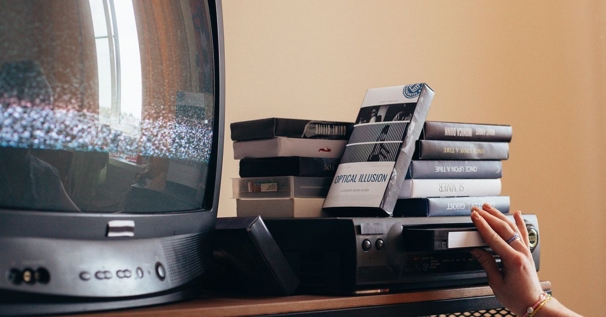 Someone covering their smart TV camera with black electrical tape