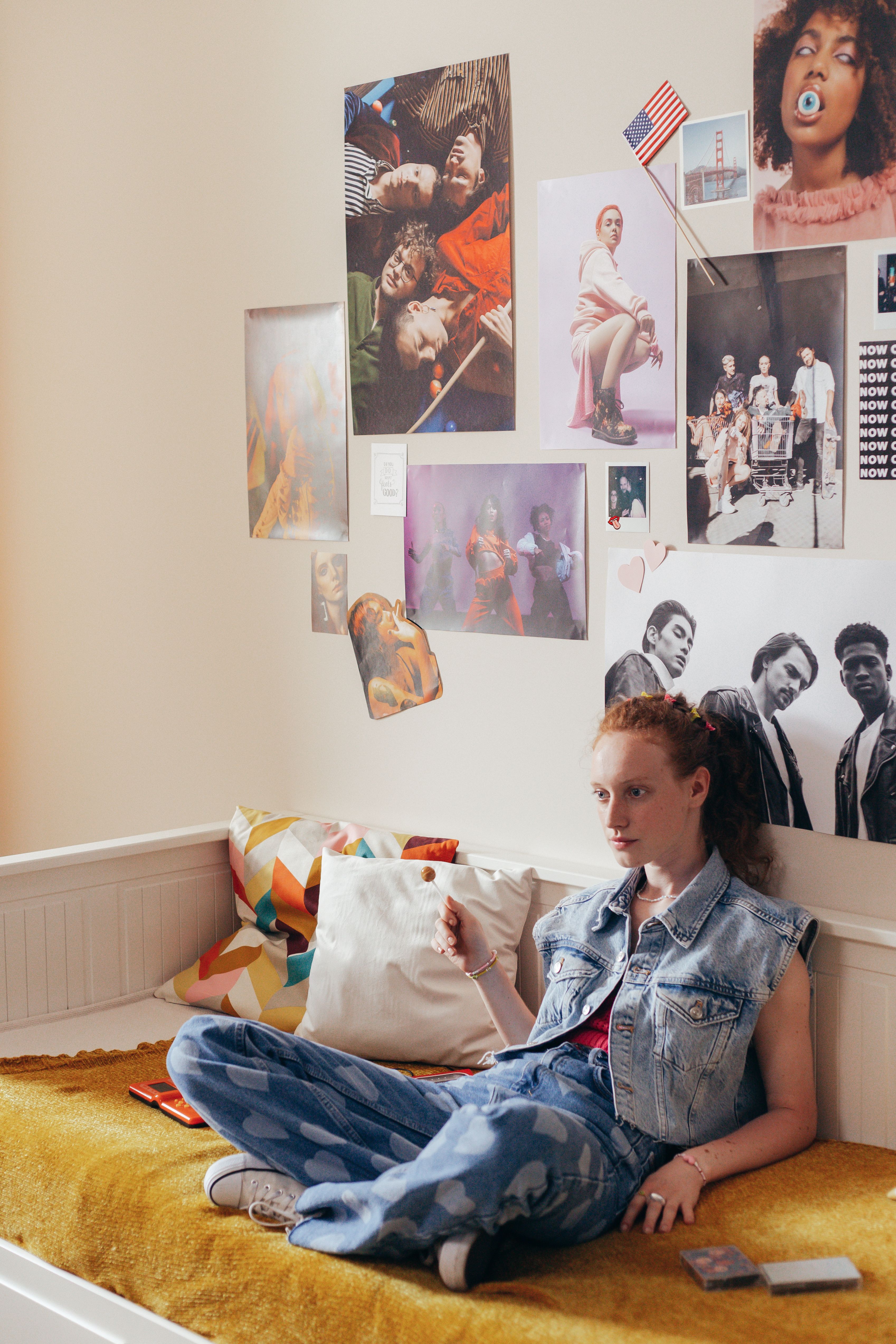 Woman in Denim Vest Sitting on Couch · Free Stock Photo
