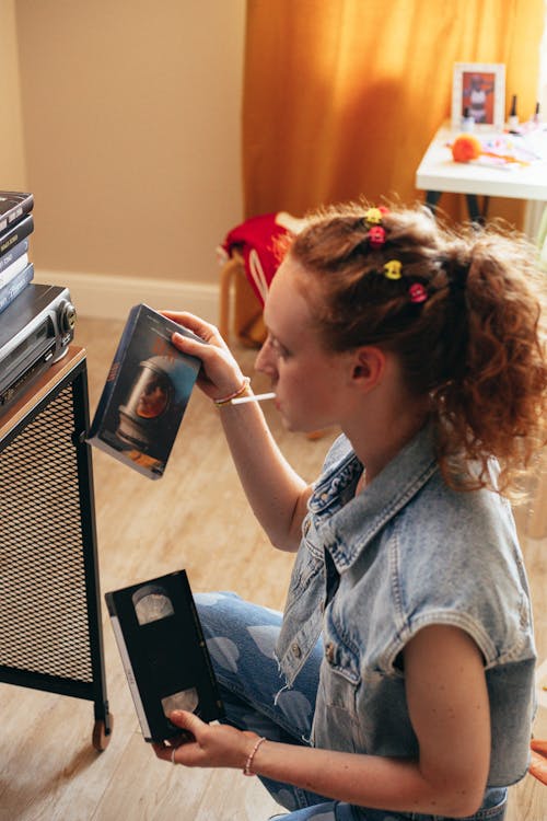 Woman Holding a Vhs Tape