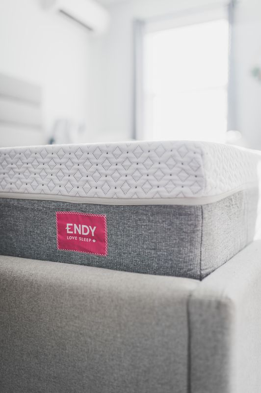 Close-up of a mattress surface showing its quilted texture.