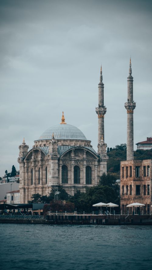 Free A stunning view of the ornate Ortaköy Mosque with its iconic minarets beside the Bosphorus in Istanbul. Stock Photo
