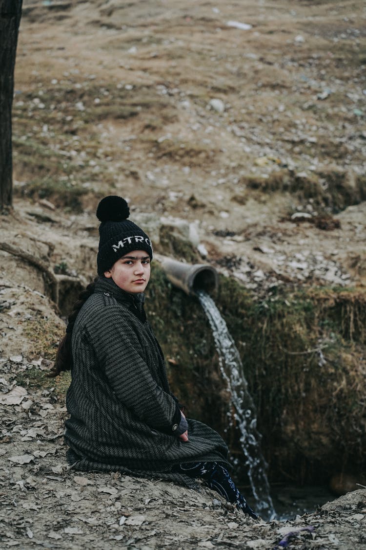 Girl Sitting Near Pipe