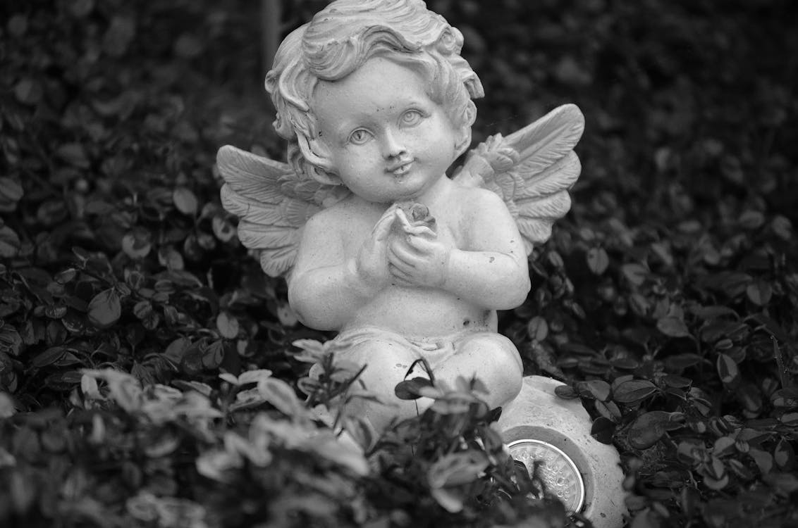 Monochrome Photo of an Angel Figurine · Free Stock Photo