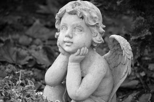 Grayscale Photograph of an Angel Statue