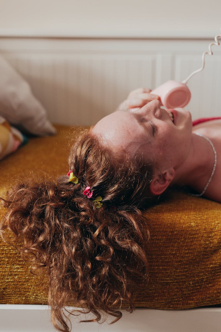 Smiling Woman Talking On Telephone