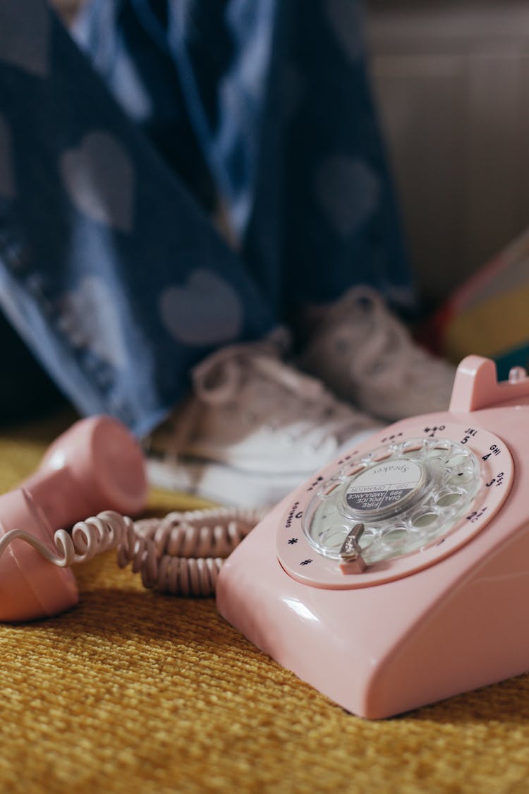 Close-up Photo Of A Pink Rotary Phone