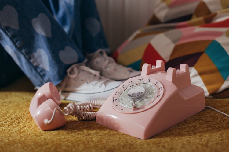 Close-Up Photo Of A Pink Rotary Phone