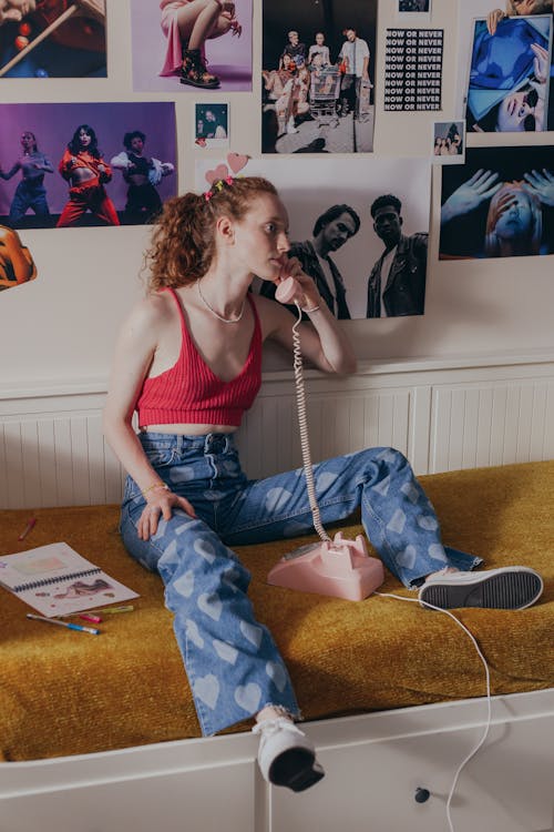 Girl Wearing a Red Crop Top on a Phone Call · Free Stock Photo