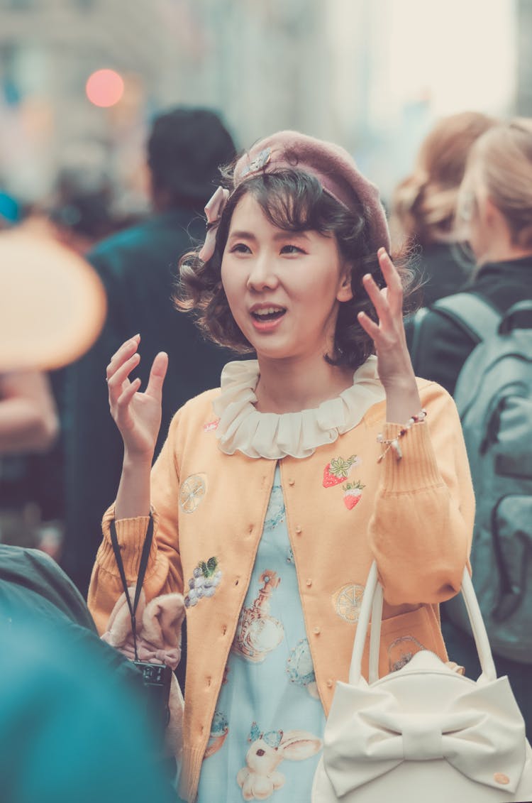 Young Woman Among The Crowd In City 