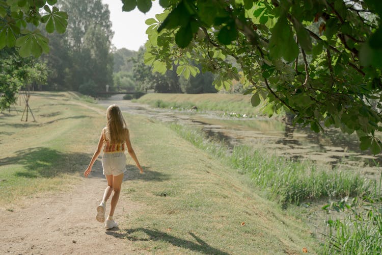 Girl Running On Path