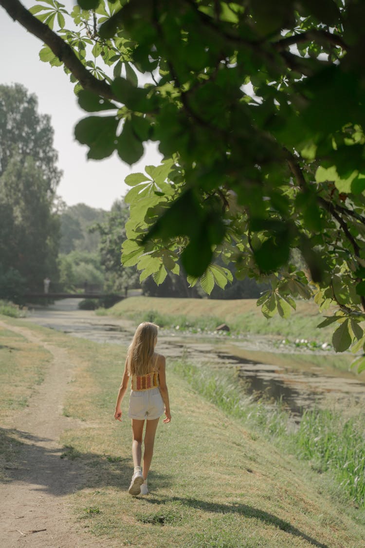 Girl Walking On Path