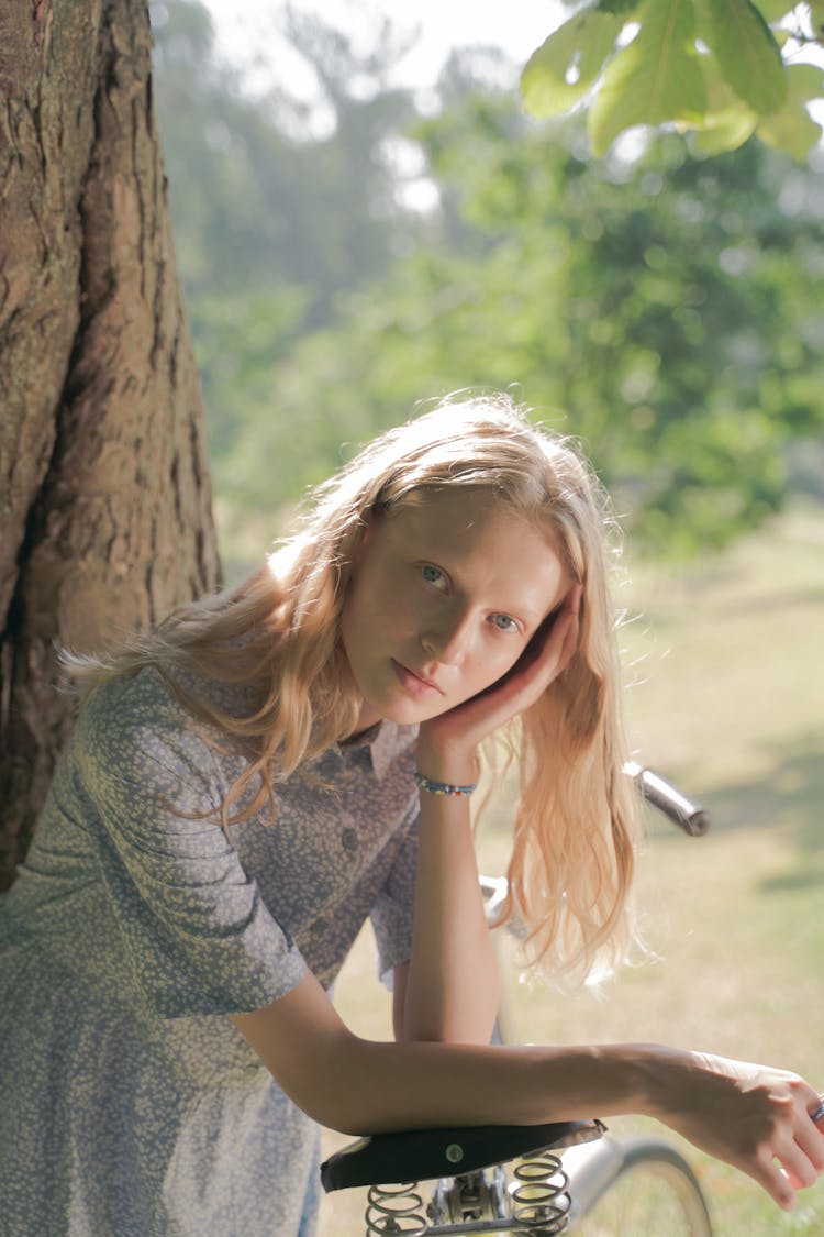 Portrait Of Teenage Girl Leaning On Bicycle 