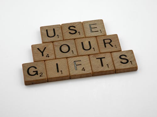 Wooden Letter Tiles in Close Up Photography