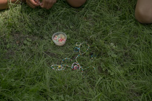 Handicraft Beads Bracelets Laying on Grass