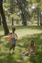 Girls Playing with Colorful Nets in Grass