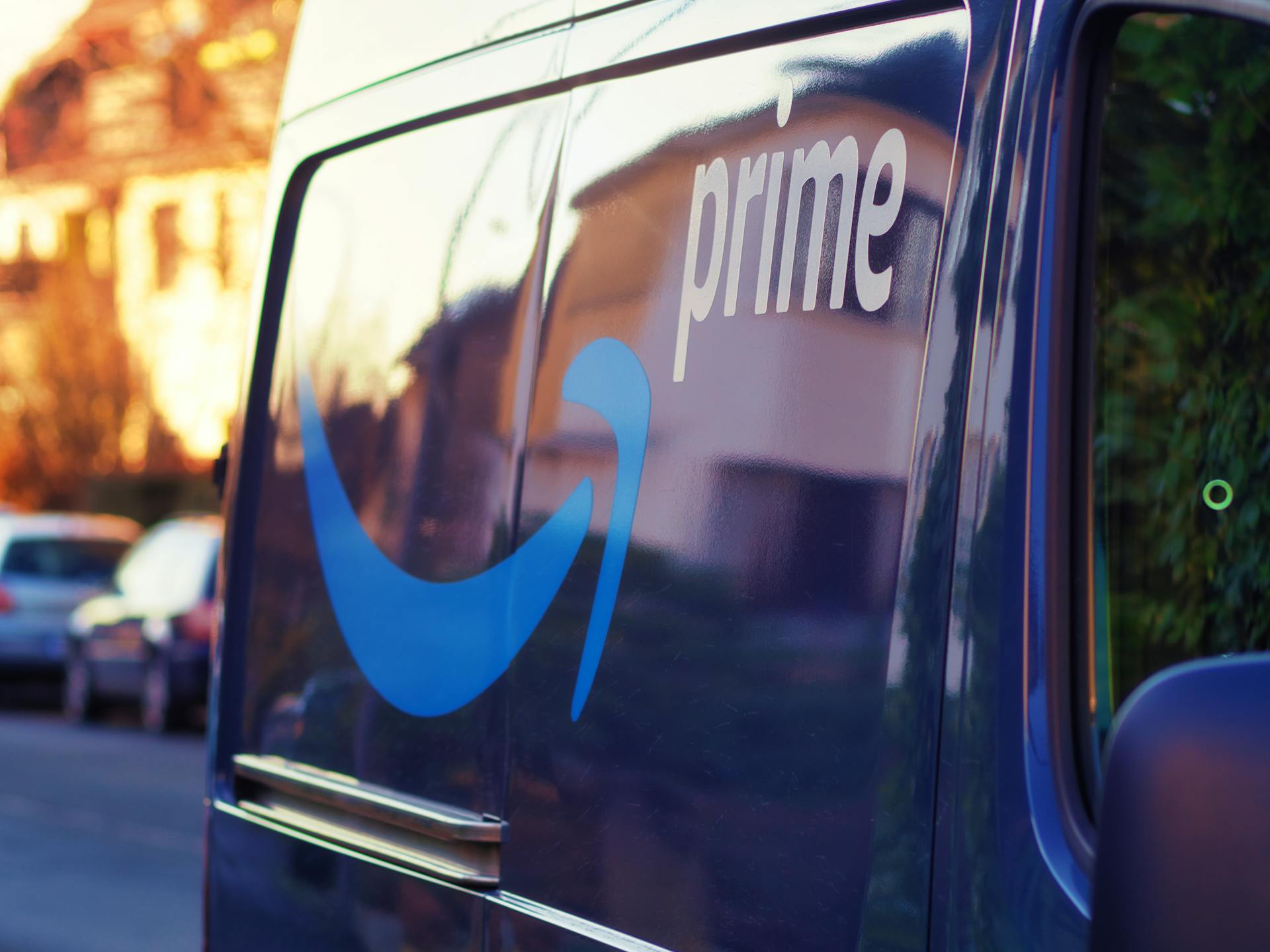 A close-up shot of a delivery van featuring a prominent blue logo and text 'prime'.