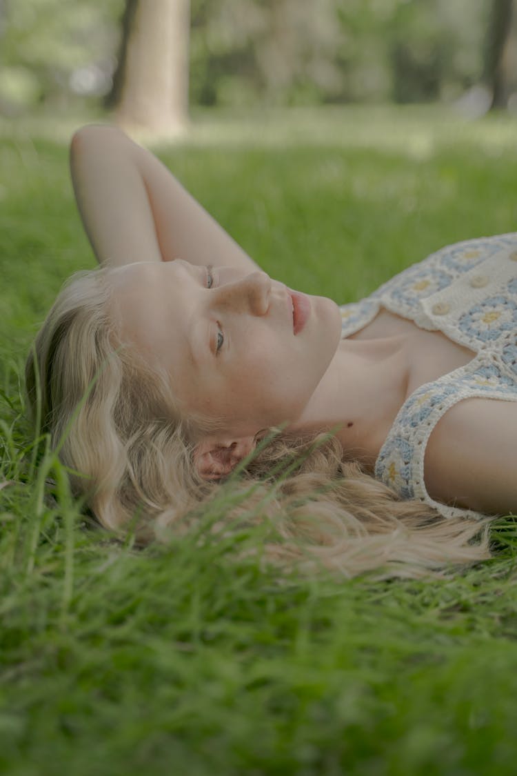 Woman Laying On The Grass