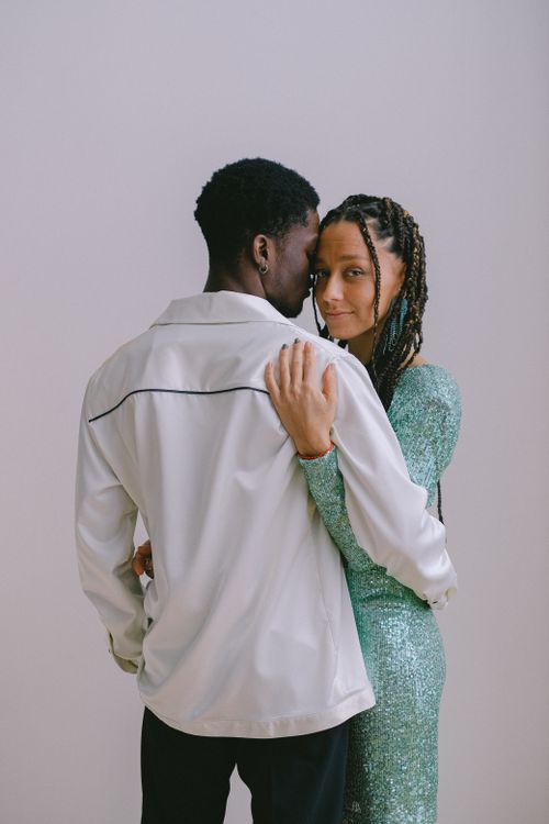Free A loving couple embraces in a studio setting, showcasing affection and connection. Stock Photo