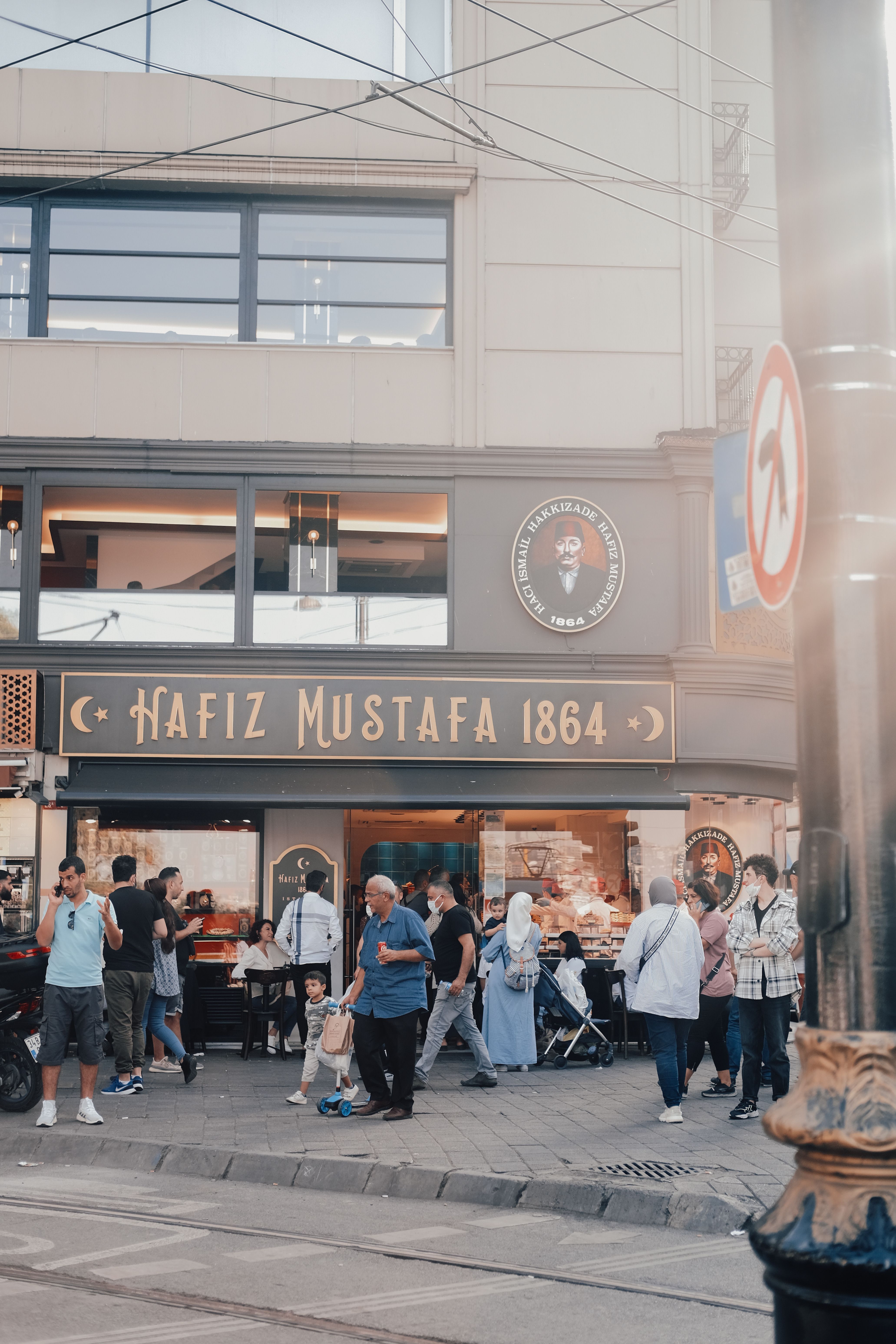 Busy street scene in front of the iconic Hafiz Mustafa store, capturing vibrant city life in Istanbul, Turkey.
