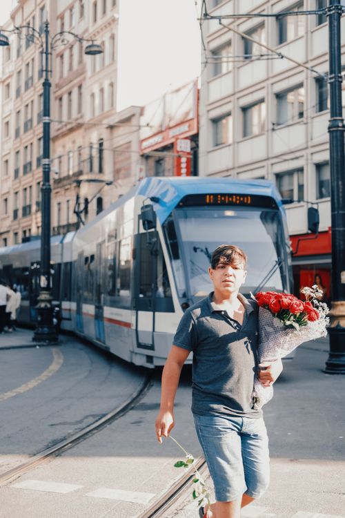 Man Carrying Roses A Man Carrying Bouquet of Red Roses · Free Stock Photo