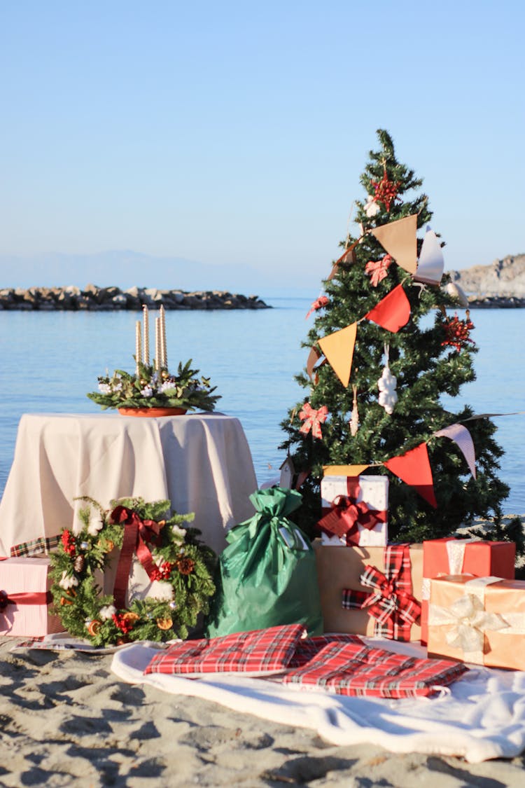 Christmas Tree And Presents On The Beach