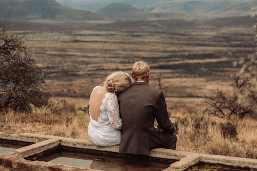 Free Newlywed Couple Looking at View of Rural Area Stock Photo