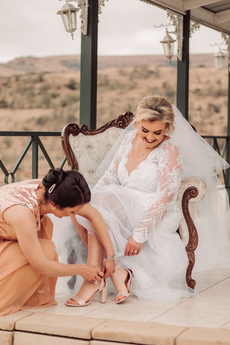 Bridesmaid Helping Bride