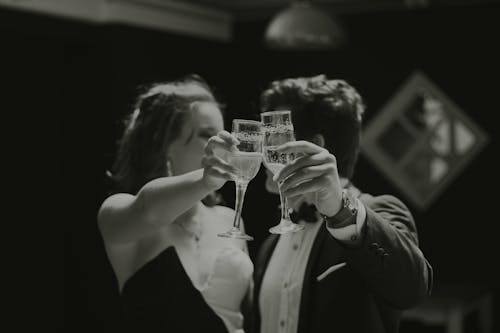 Free Man and Woman Holding Champagne Glasses Stock Photo
