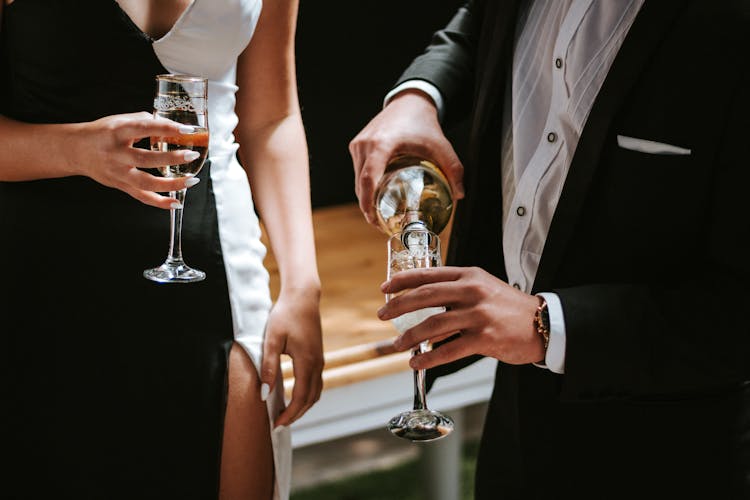 Man Pouring Champagne In Glass