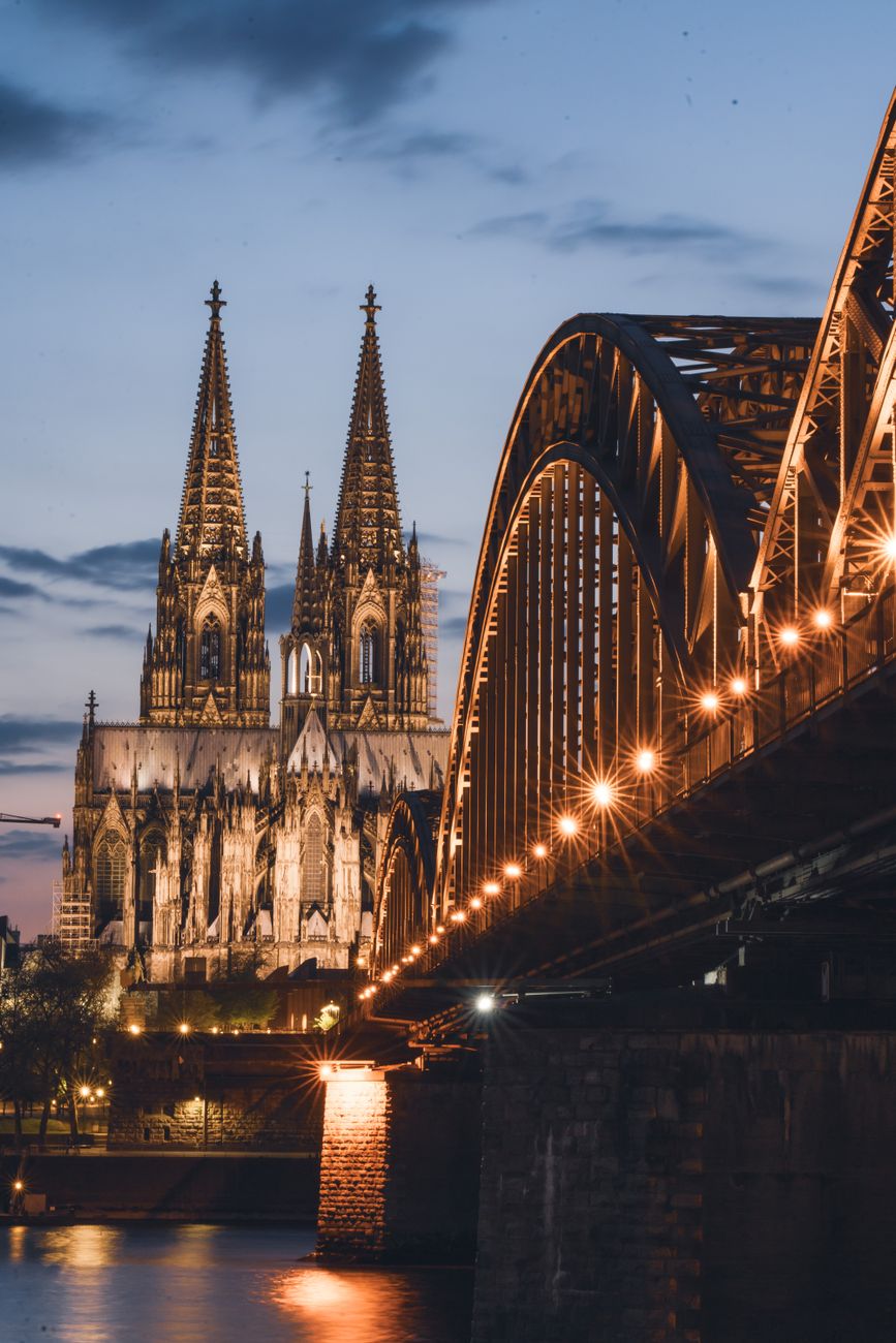 Cologne Rhine river at sunset with cathedral silhouette
