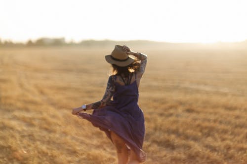 Back View of a Woman Wearing Hat