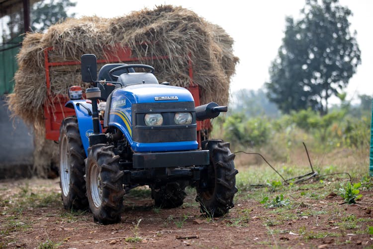 Tractor And Trailer With Hay On It