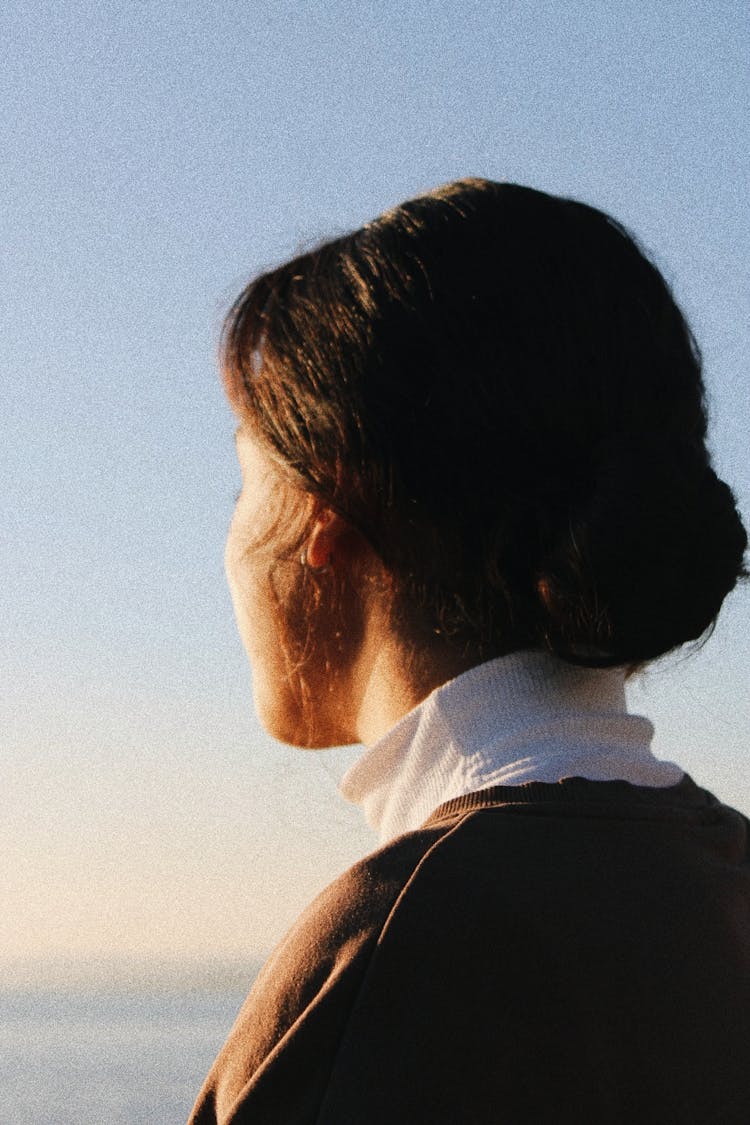 Back View Of A Woman Looking At The Sea