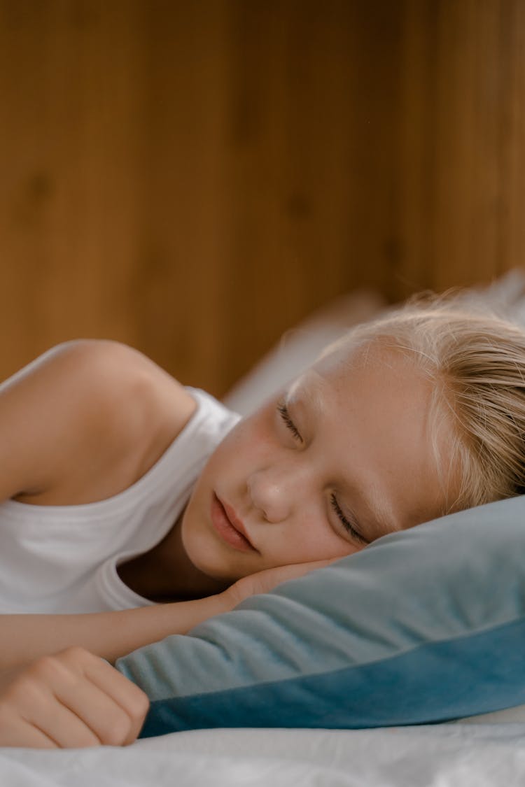 Child Sleeping In Bed