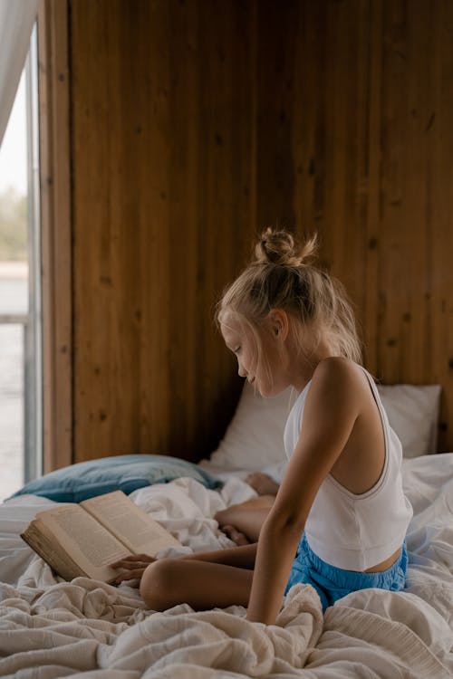 Blond Girl Reading Book